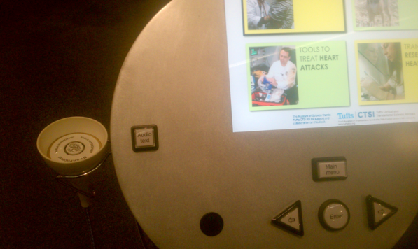 An image of the button interface at a Museum of Science single-user kiosk
